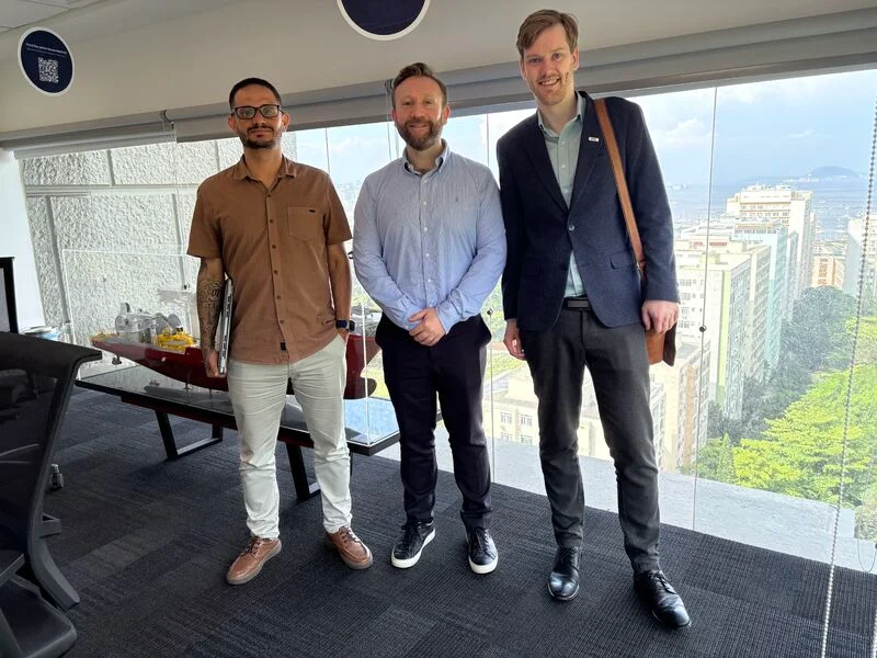 Three attendees at a meeting during Dipai’s Brazil visit.
